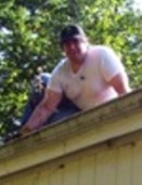 Justin cleaning roof gutters